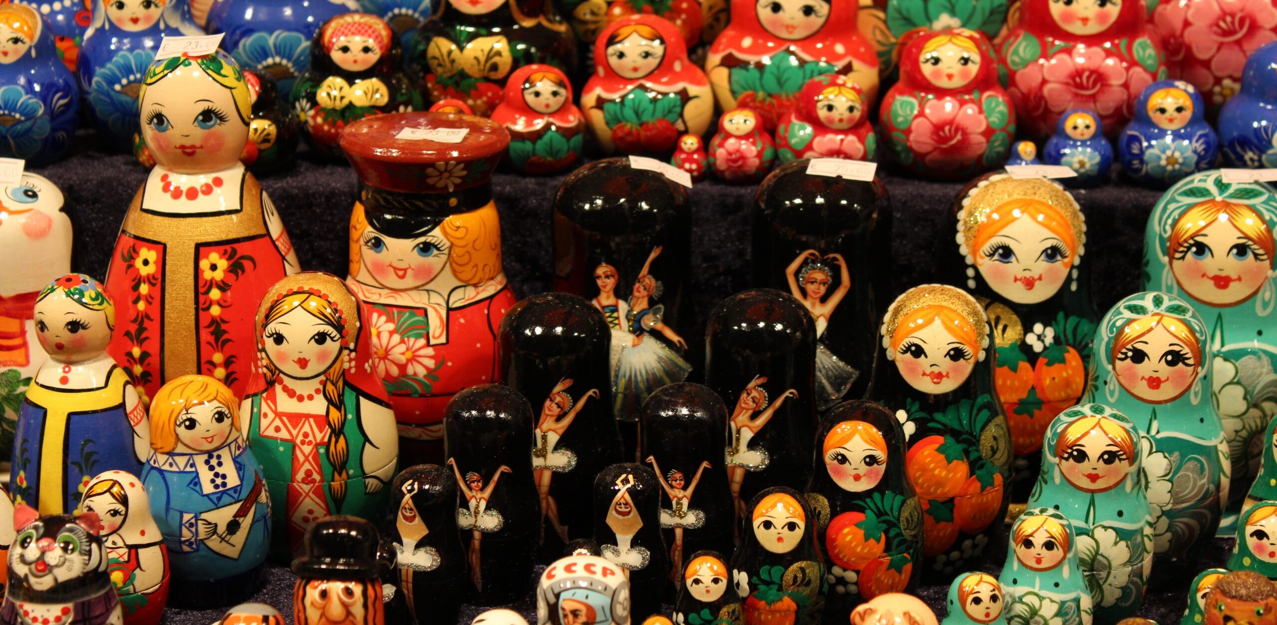 Rows of colorful Russian nesting dolls of different sizes