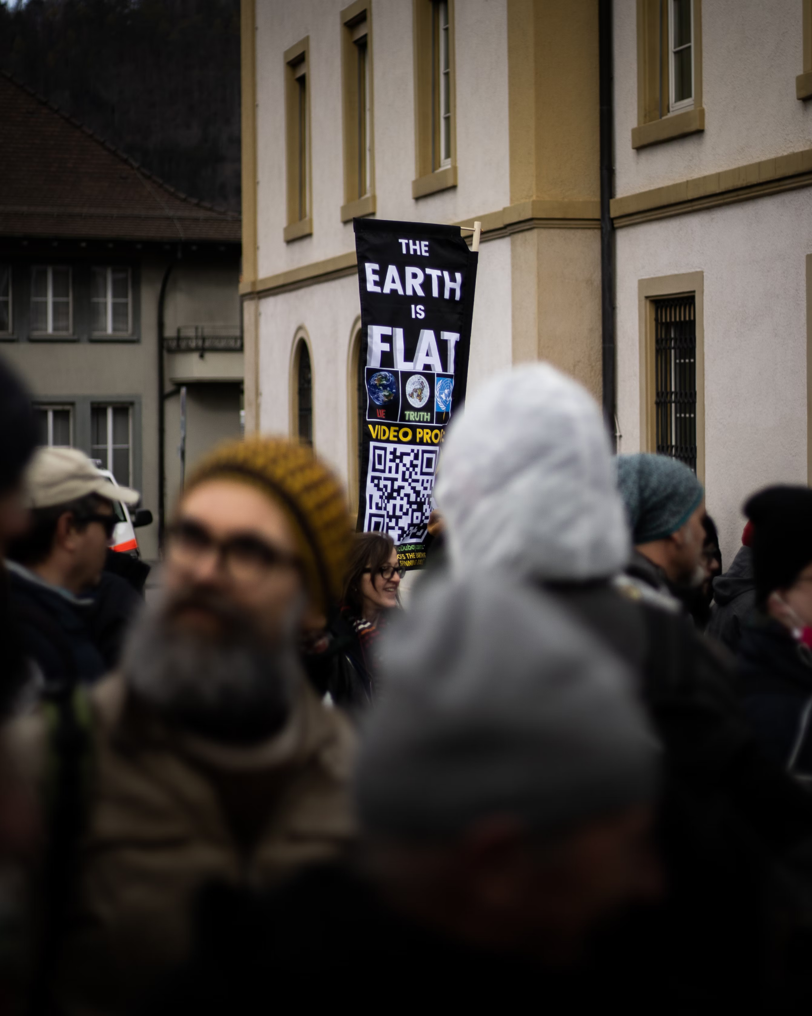 “The Earth is Flat” sign at a 2021 protest in Liestal, Switzerland, against pandemic measures