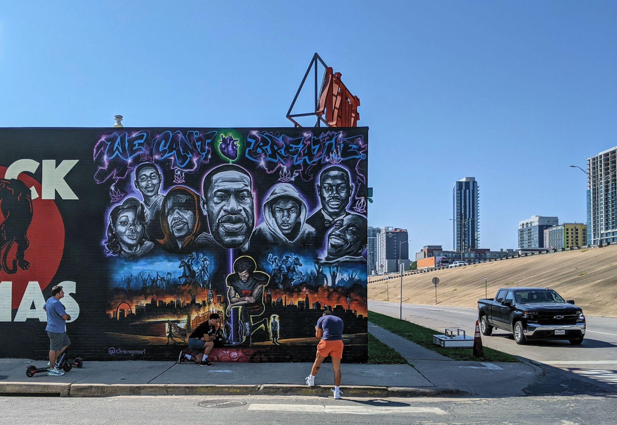 Photograph of a mural in Austin, Texas, that depicts Colin Kaepernick kneeling in front of images of George Floyd, Ahmaud Arbery, Eric Garner, Tamir Rice, Trayvon Martin, Breonna Taylor, and Mike Ramos.